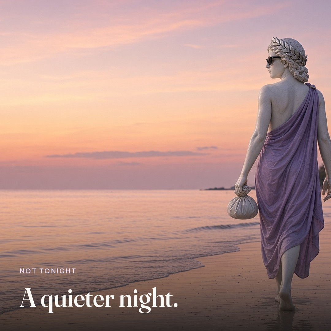 She walks the shore at dusk. The picture says A quieter night.